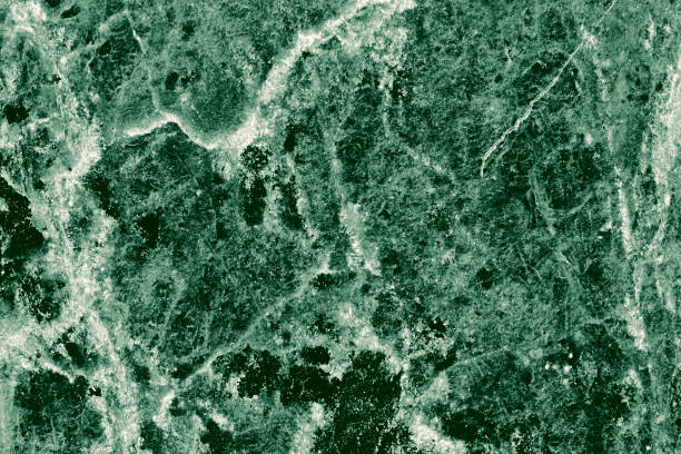 istock Real closeup of dark green marble stone texture surface background. Design pattern with high resolution for luxury home decoration. Abstract matt slab rock material. Front view of natural tiles stone surface. 2200611066