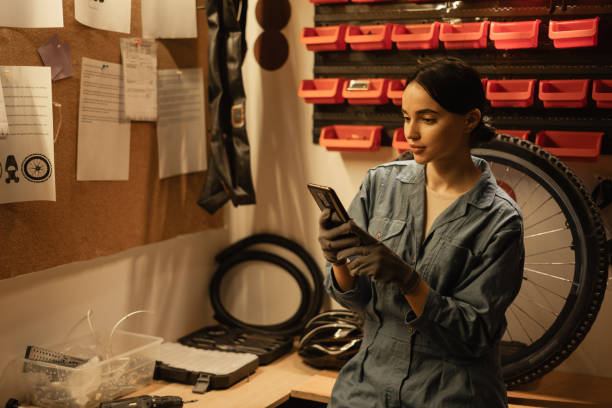istock Female mechanic blogging about bicycle repair 2200611405