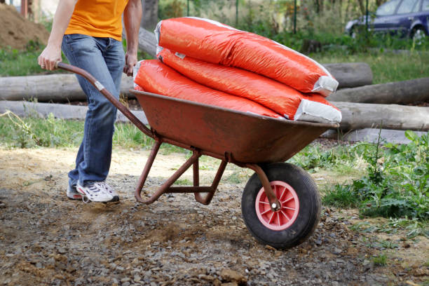 istock Wheelbarrow loaded with plastic bags 2200614080
