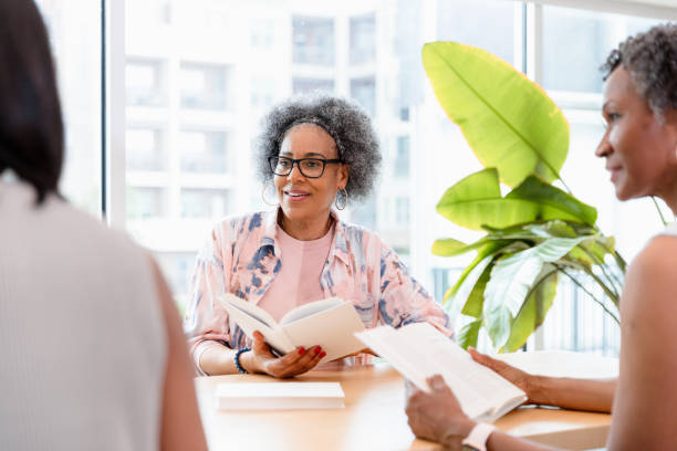 istock Mature Women Sharing Books and Engaging in Discussion 2200614439