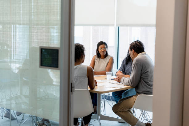 istock Group therapy session: Diverse adults discussing mental health 2200614516