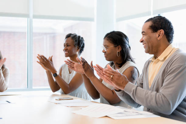 istock Multiracial Group Applauding Together in Meeting 2200614541