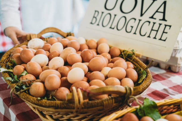 istock Farmer selling fresh organic eggs at local market 2200615088
