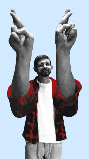 istock Man raising crossed fingers with an exaggerated pose represents hope and uncertainty. Conceptual art collage. 2200615603