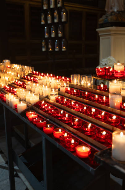 istock Burning candles on altar in church. 2200621711