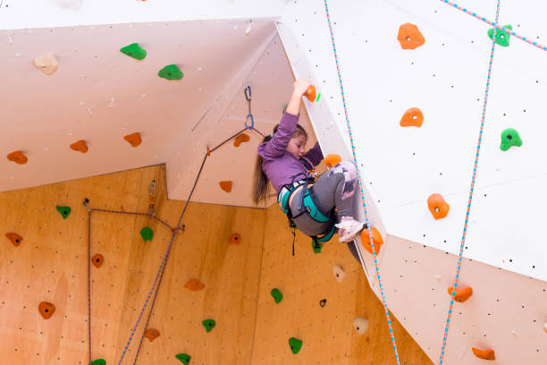 istock Girl Climbing an Indoor Rock Wall 2200624172