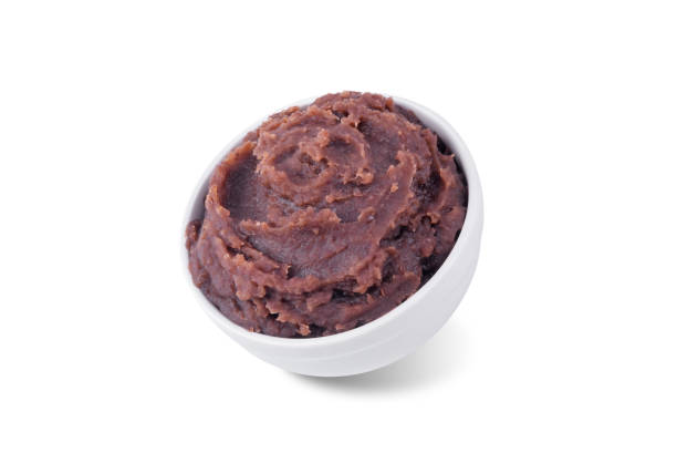 istock Sweet red bean paste, anko in a bowl on a white isolated background 2200626816