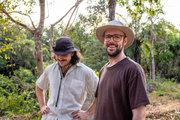istock Two men on adventure in tropical forest 2200629047