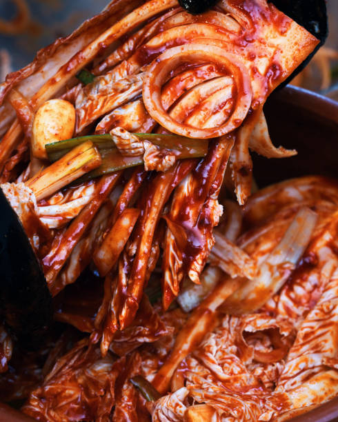 istock Fermented Foods - Preparing Kimchi with Red Pepper Paste 2200631856