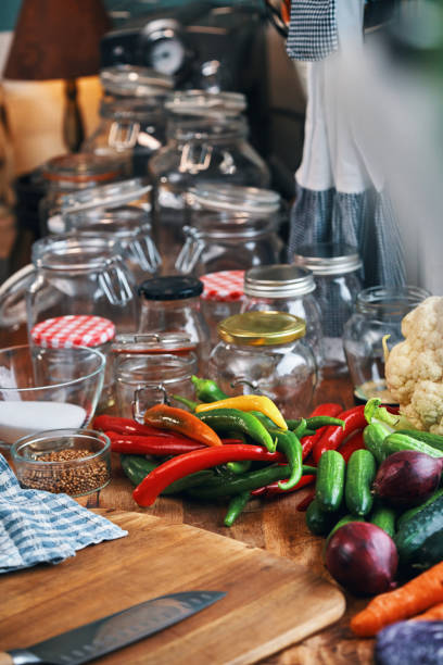 Fermented Foods - Preparing Fermented Cucumbers with Spices and Filled in a Jar