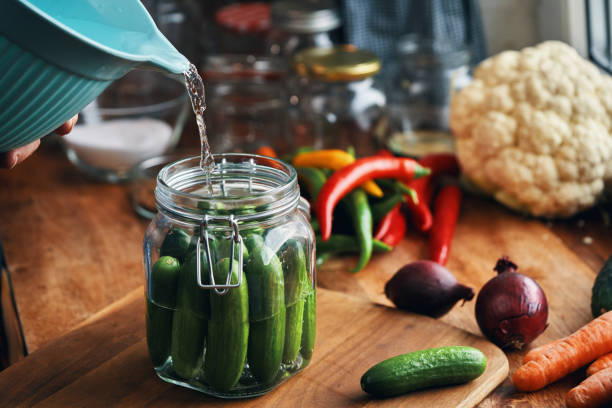 istock Fermented Foods - Preparing Fermented Cucumbers with Spices 2200633875