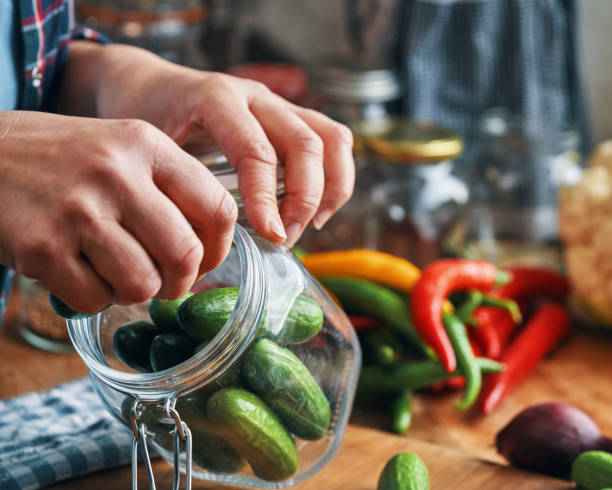 istock Fermented Foods - Preparing Fermented Cucumbers with Spices 2200634015