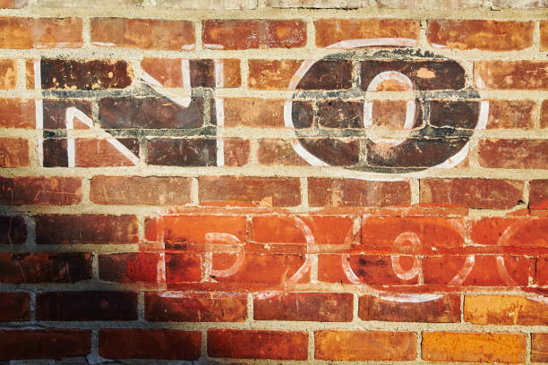 istock Vintage Brick Wall Texture with Faded Paint Close-Up 2200634445