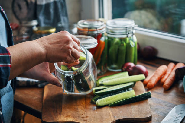 istock Fermented Foods - Preparing Fermented Cucumbers with Spices 2200634566