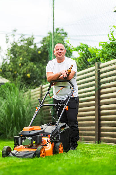 istock Gardener enjoying a beer after mowing the lawn 2200634712