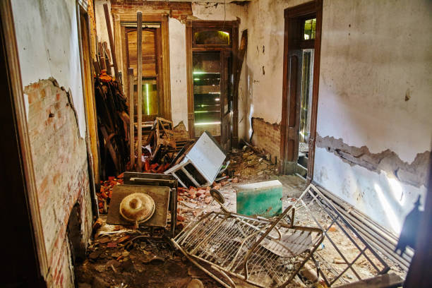 istock Abandoned Building Interior with Broken Furniture and Straw Hat, Eye-Level View 2200635067