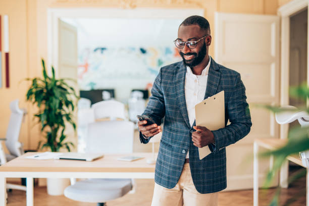 istock Businessman texting in the office. 2200635447