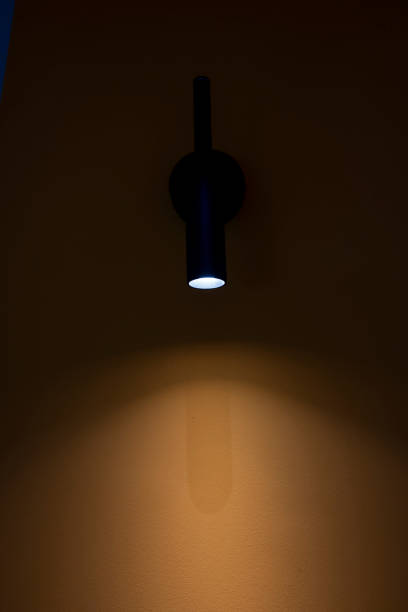 istock The wall lamp on the yellow wall 2200637633