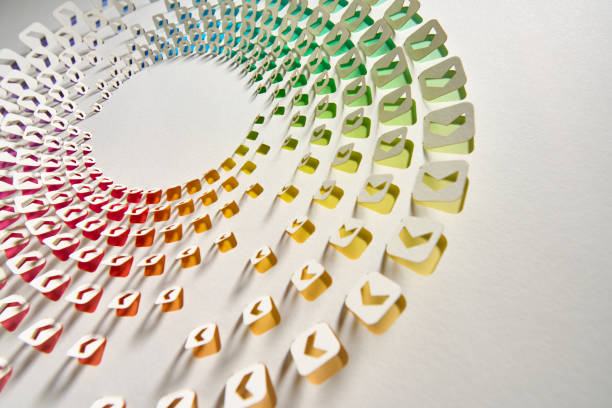 istock Geometric Cut Paper Artwork Featuring Arrow Icons with Vibrant Gradient and Shadows on White Background in Still Life Photography 2200638650