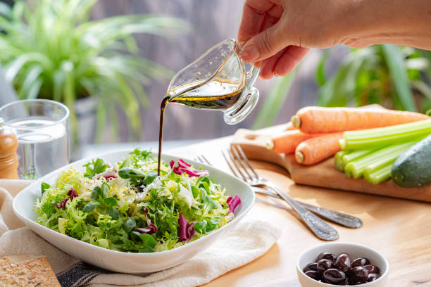 istock Seasoning salad with vinaigrette dressing 2200651059