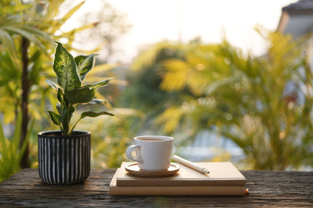 istock White coffee cup and notebook, outdoor cozy working space 2200652395