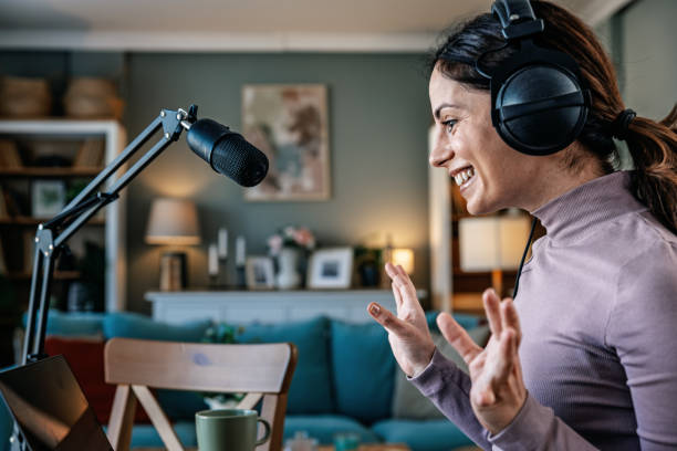 istock Joyful woman recording live podcast 2200655631