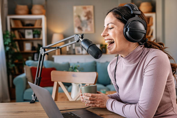 istock Joyful woman recording live podcast 2200655858