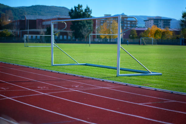 istock Empty soccer goals on green sports field 2200655859