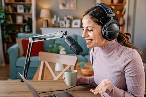 istock Joyful woman recording live podcast 2200655863