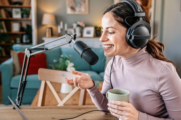 istock Joyful woman recording live podcast 2200655864
