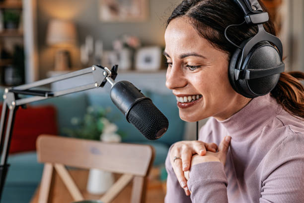 istock Joyful woman recording live podcast 2200655952
