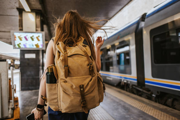 istock Solo Traveler Boarding a Train 2200656542