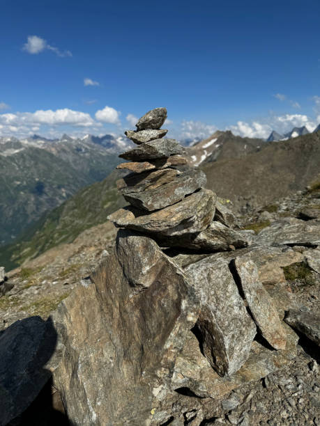 istock Pyramid made of angular stones on top of a mountain. Balance, equilibrium symbol 2200658040
