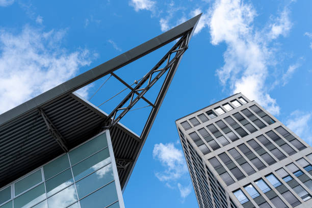 Germany, Berlin, Central Berlin. September 10, 2024 - Low angle view of modern office buildings against sky