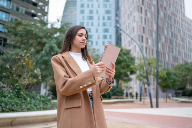 istock Businesswoman using digital tablet in urban setting 2200659832