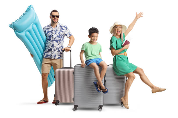 istock Happy family with suitcases getting ready for a summer vacation 2200660350