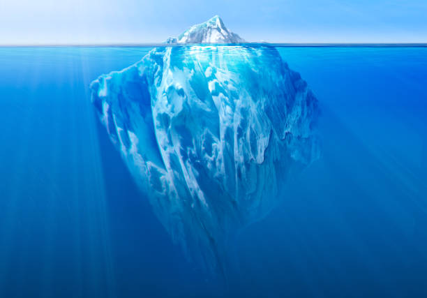 istock Massive iceberg floating in the ocean, with a small visible tip above water and a vast submerged section beneath. 2200661438