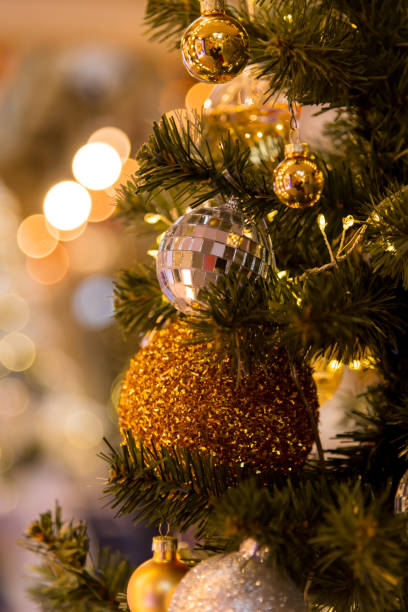 istock Holiday decorations glow on the Christmas tree for New Year 2200662581
