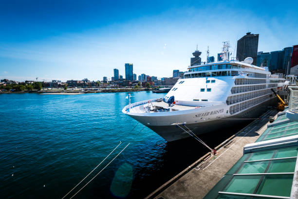 Vancouver, Canada - August 17, 2023: Huge cruise ship laying at a modern pier in Vancouver in Canada.