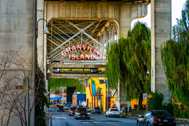 Entrance to Granville island in Vancouver, Canada Vancouver, Canada - August 17, 2023: Entrance to Granville Island. It used to be an industrial manufacturing area but now it is an entertainment area with restaurants, cafes, theaters and a hotel. granville island stock pictures, royalty-free photos & images