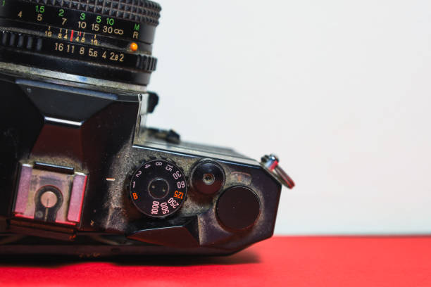 istock Vintage black SLR camera with dust and scratches 2200667417