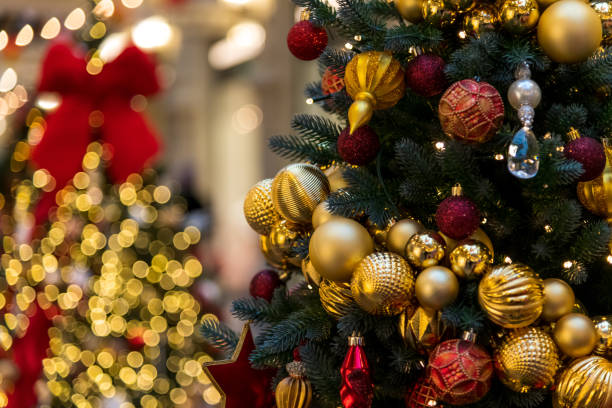 istock Christmas trees with golden ornaments decorated a mall 2200667502