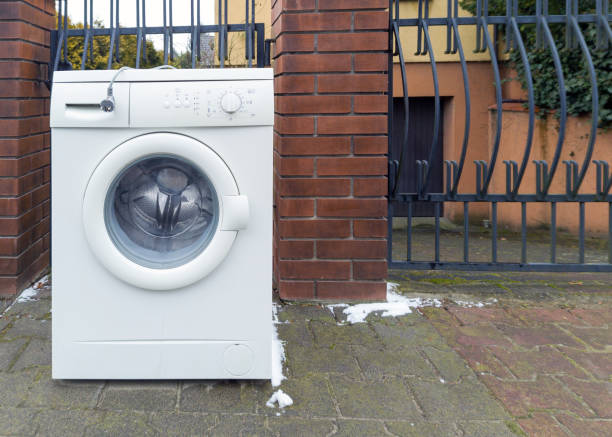 istock Old Broken Washing Machine Left on the Street 2200667891
