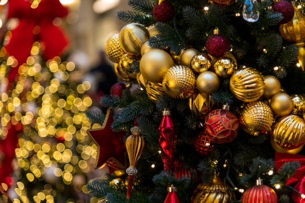 istock Festive decorations on a Christmas tree shine brightly for New Year celebrations 2200668086