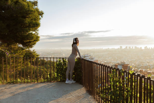 istock Woman enjoying scenic city view during exercise 2200669469