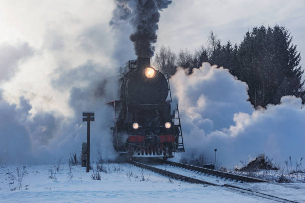 istock Retro train moves at winter morning. 2200672368