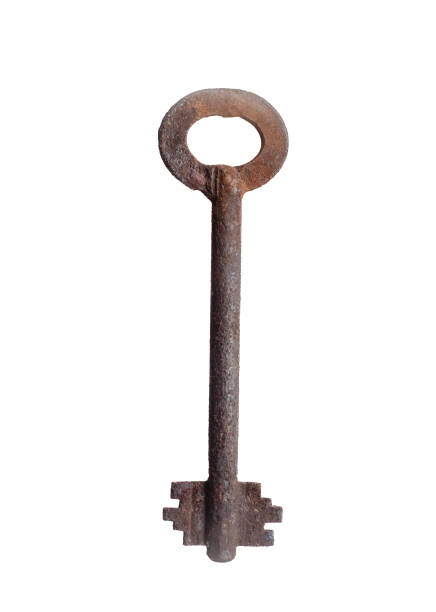 old rusty key covered with a thick layer of corrosion on an isolated white background