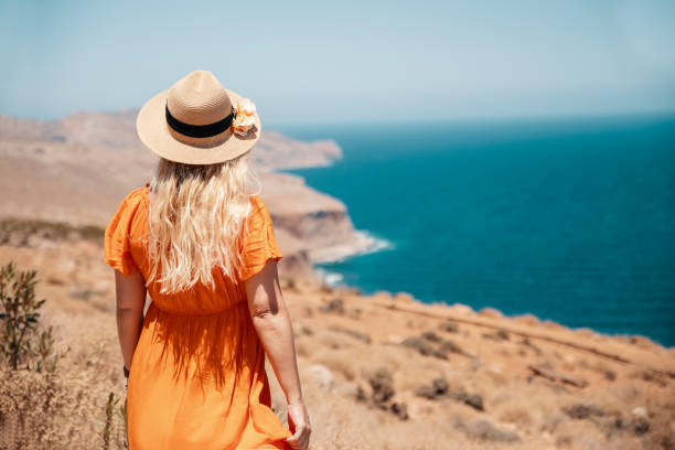 istock Woman admiring awesome coastal view 2200681864