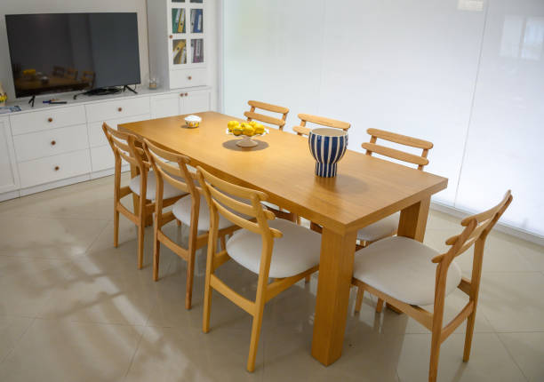 istock Elegant wooden dining table adorned with citrus centerpiece in a modern bright kitchen setting 2200684544