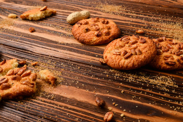 istock Peanut cookies on wooden table with sugar. 2200684616